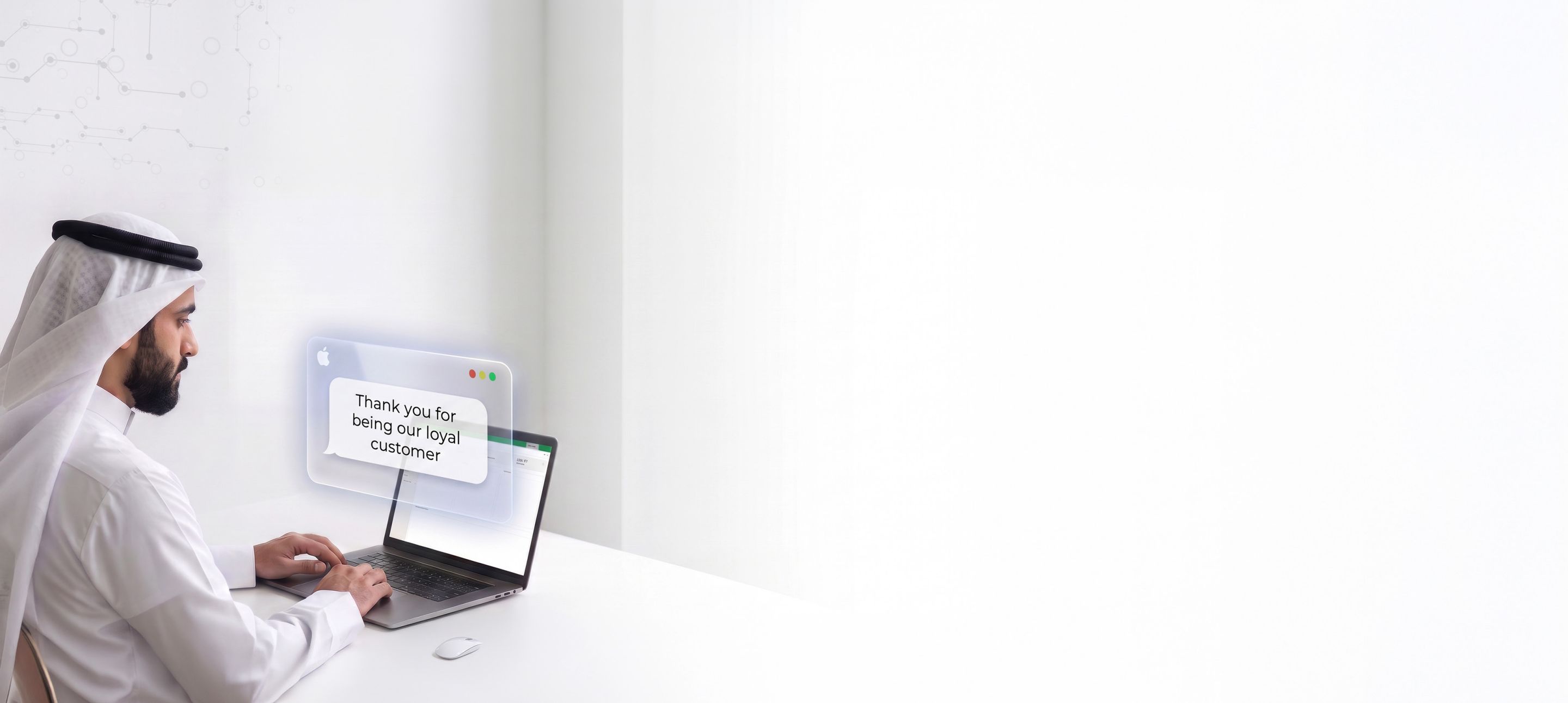 Business owner sending a thank-you SMS to customers from a laptop